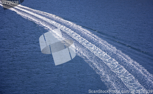 Image of Trail on sea surface behind of speed boats