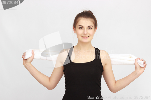 Image of Beautiful sporty girl with towel