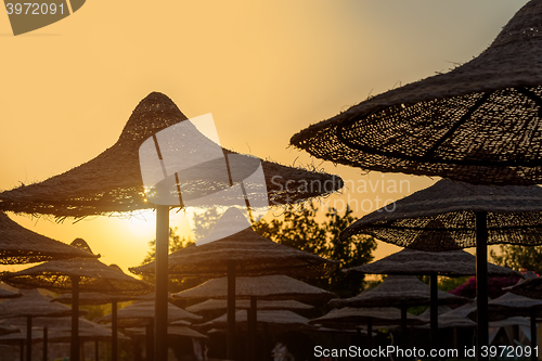 Image of Beach umbrellas and blue sky background