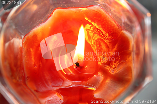 Image of Orange burning candle