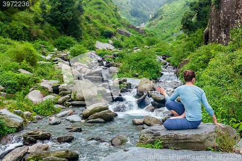 Image of Woman doing Ashtanga Vinyasa Yoga asana Marichyasana D