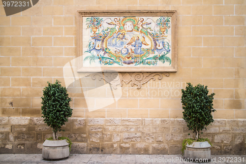 Image of painting on the wall tiles in the street in Valencia