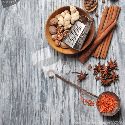 Image of Various spices on wood