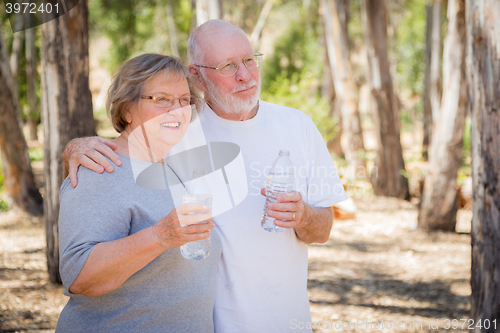 Image of Happy Healthy Senior Couple with Water Bottles