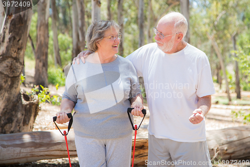 Image of Happy Senior Couple Exercising Outside Together