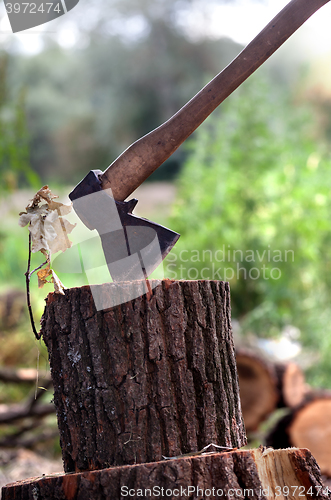 Image of Axe in oak stump