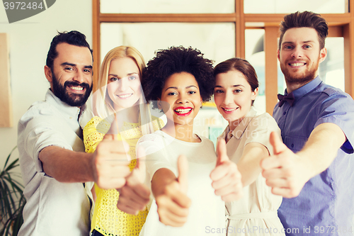 Image of happy creative team in office