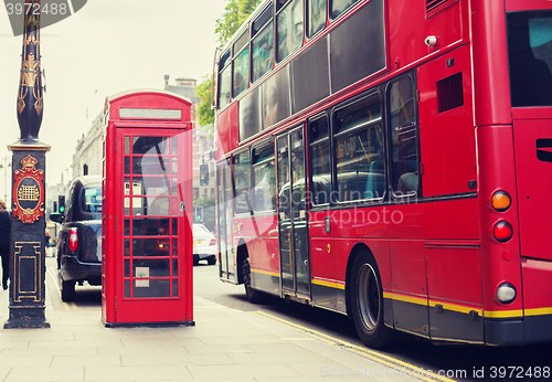 Image of double decker bus and telephone booth in london