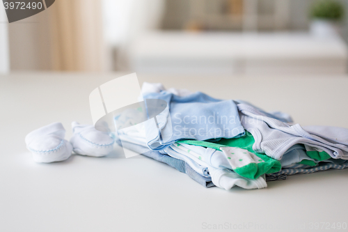 Image of close up of baby boys clothes for newborn on table