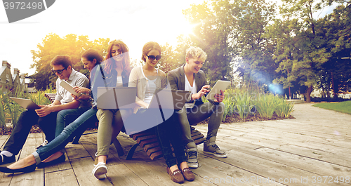 Image of students or teenagers with laptop computers