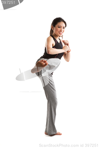 Image of Kicking asian girl