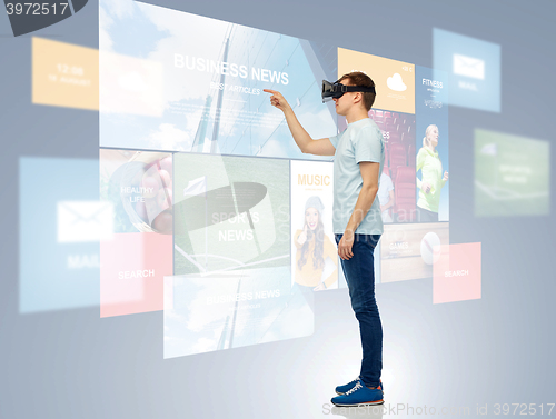 Image of happy man in virtual reality headset or 3d glasses