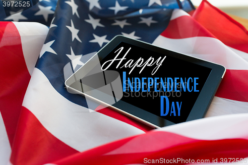 Image of happy independence day on tablet pc american flag