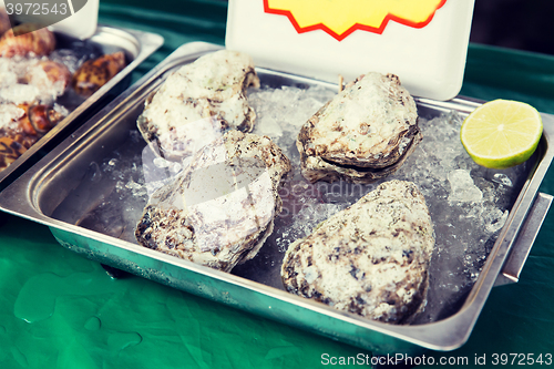 Image of oysters or seafood on ice at asian street market