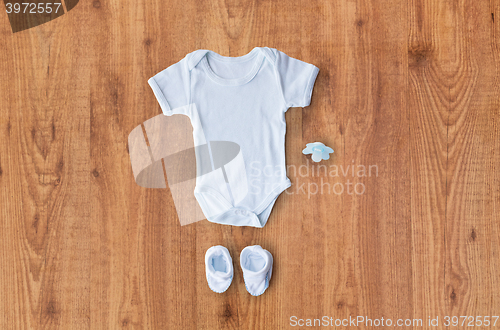 Image of close up of baby boys clothes for newborn on table