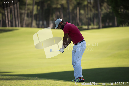 Image of golf player hitting long shot