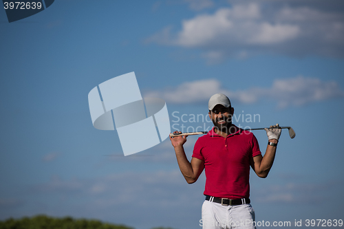 Image of handsome middle eastern golf player portrait at course