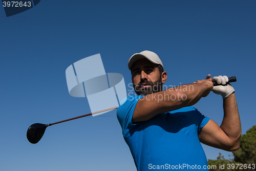 Image of golf player hitting shot