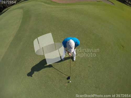 Image of top view of golf player hitting shot