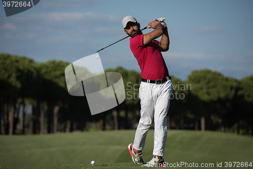 Image of golf player hitting long shot
