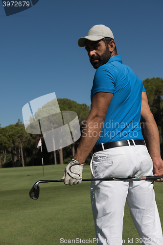 Image of golf player portrait from back