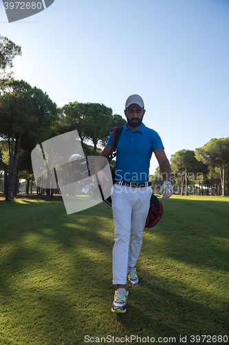 Image of golf player walking