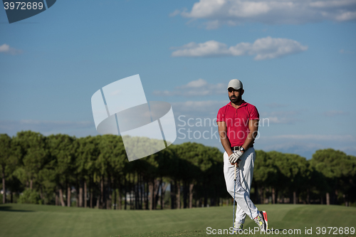 Image of handsome middle eastern golf player portrait at course