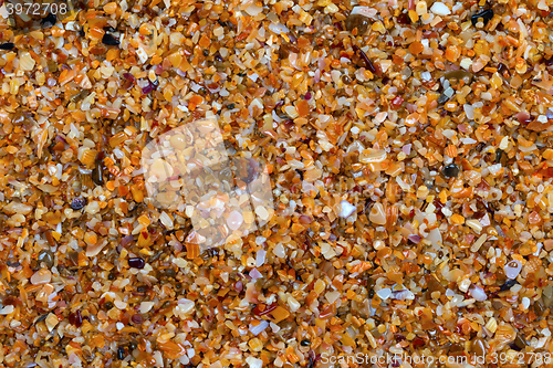 Image of Multicolor sand on beach in sun summer day