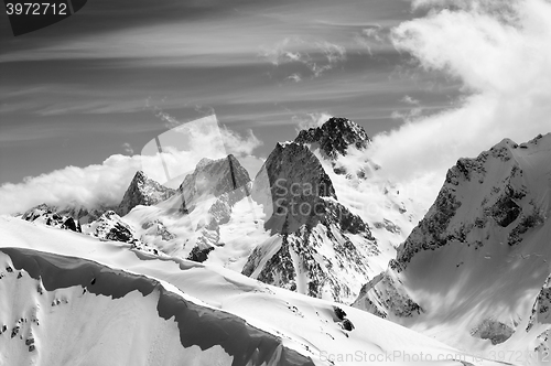 Image of Black and white winter mountains with snow cornice