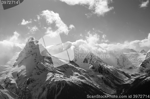 Image of Black and white winter mountains with clouds
