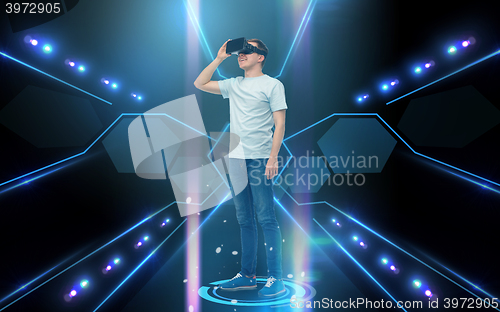 Image of happy man in virtual reality headset or 3d glasses