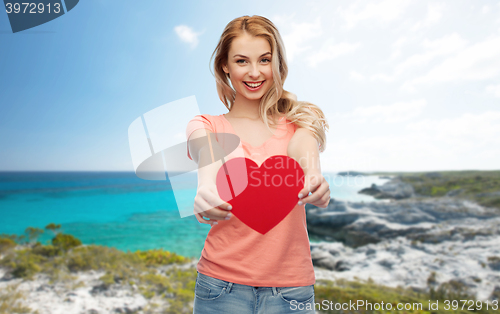 Image of happy woman or teen girl with red heart shape