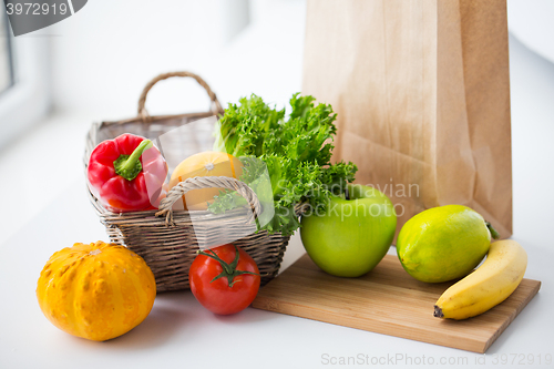 Image of basket of fresh friuts and vegetables at kitchen