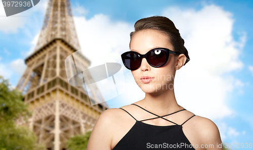 Image of beautiful young woman in elegant black sunglasses