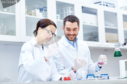 Image of young scientists making test or research in lab