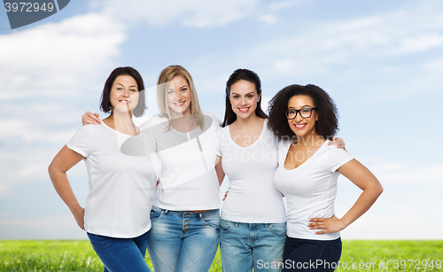 Image of group of happy different women in white t-shirts