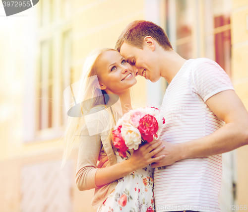 Image of couple with flowers in the city