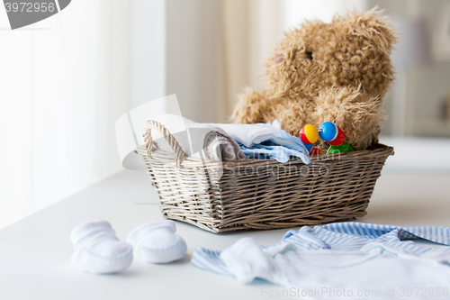 Image of close up of baby clothes and toys for newborn