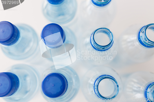 Image of close up of bottles with drinking water on table