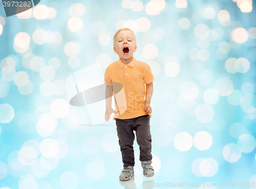 Image of happy little boy shouting or sneezing