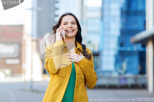 Image of smiling young woman or girl calling on smartphone