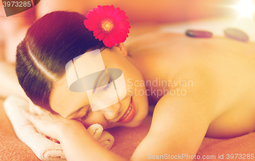 Image of woman in spa with hot stones