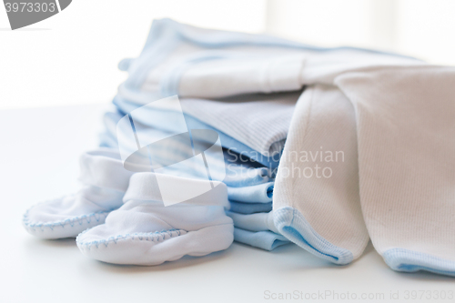 Image of close up of baby boys clothes for newborn on table