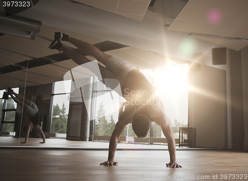 Image of man exercising in gym