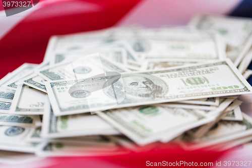 Image of close up of american flag and dollar cash money