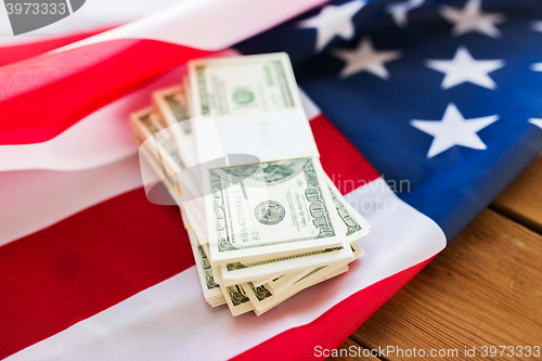 Image of close up of american flag and dollar cash money