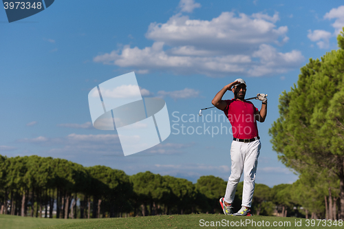Image of golf player hitting long shot