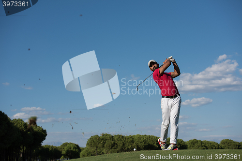 Image of golf player hitting long shot