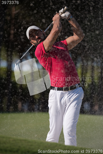 Image of golfer hitting a sand bunker shot