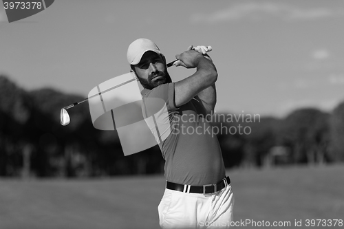 Image of golfer hitting a sand bunker shot